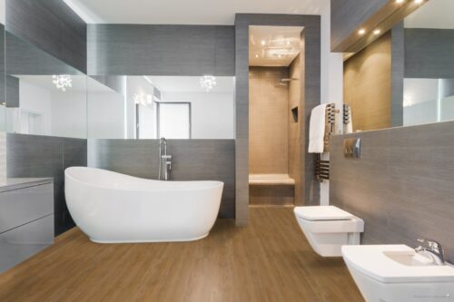 Ovaal bad in badkamer op een Therdex pvc vloer
