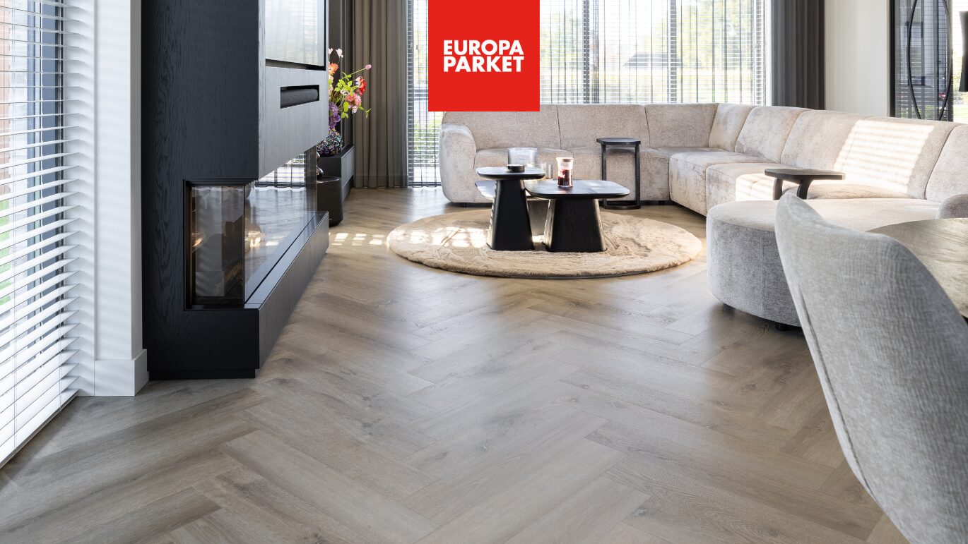 Project Therdex visgraat pvc vloerwoonkamer rond vloerkleed hoekbank